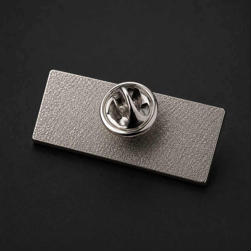 Pin's métallique avec le logo NENA